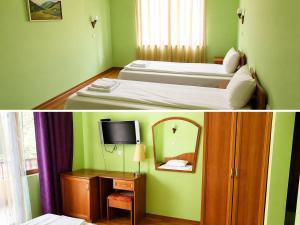 a hotel room with two beds and a mirror at Хотел Галина Палас in Srem