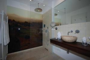 a bathroom with a sink and a shower at Hotel Boskamp in Bergisch Gladbach +38 photos