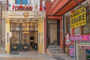 an entrance to a building with a sign for a restaurant at Bazaar Hotels Old City in Istanbul