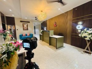 a camera on a tripod in a hair salon at The Grand Dularia in Nagpur