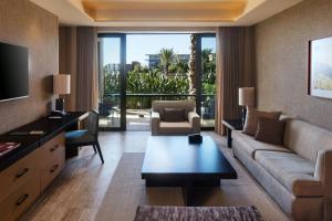 a living room with a couch and a table at JW Marriott Los Cabos Beach Resort & Spa in San José del Cabo