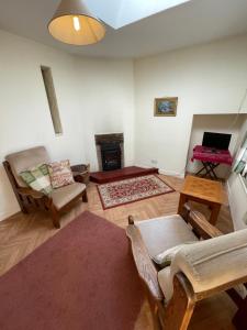 a living room with a couch and a table at Ardtarmon House in Sligo +37 photos