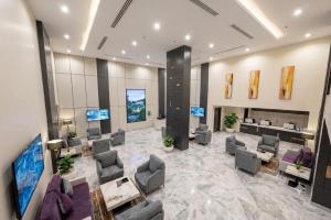 a large lobby with couches and a waiting room at Garden Melenium - Jeddah in Jeddah