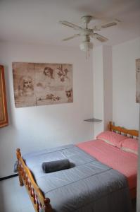 a bedroom with a bed and a ceiling fan at Costahispania 308 in Gran Alacant +39 photos