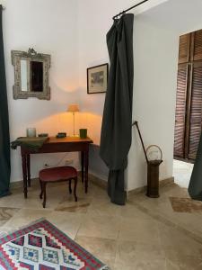 a room with a desk and a table with a rug at Château la Gineste - Castle and Vineyard in Duravel