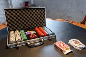 a briefcase filled with different types at Historic 2BR with Deck Games & Garage in Saint Louis +39 photos