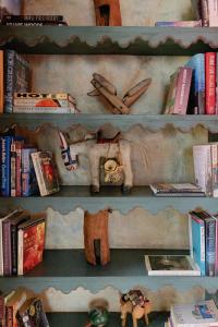 a book shelf filled with books and books at Hacienda Las Amantes in San Miguel de Allende