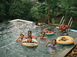 a group of people in a swimming pool at HagiangHillside in Ha Giang +33 photos