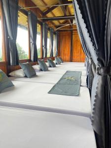 a row of beds on a train at HagiangHillside in Ha Giang
