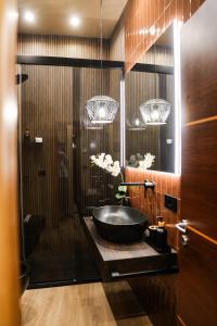 a bathroom with a black sink and a shower at Notos Home in Bitonto +60 photos