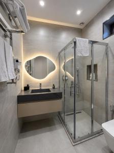 a bathroom with a sink and a shower at Amara Boutique in Baku +23 photos
