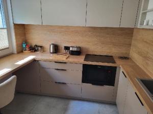 a kitchen with a counter top with a stove top oven at apartament in Tomaszów Mazowiecki