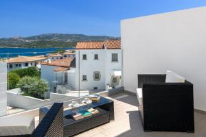a view from the balcony of a villa with a view at NRH Cannigione Sunrise Rooftop in Cannigione