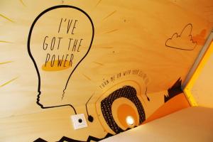 a drawing of a head on a wall with the words ive got the power at Slaaptrailer MXGP Arnhem in Arnhem