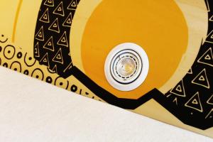 a close up of a tie with a spotlight on a yellow record at Slaaptrailer MXGP Arnhem in Arnhem