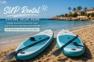 two kayaks are sitting on the sand on the beach at CC8 III by ZANIS in Torrevieja