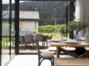 a dining room with a table and chairs at Summerset Lodge in Bamburgh