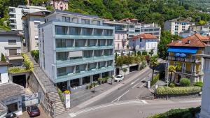 an aerial view of a city street with buildings at Hotel Muralto Locarno in Locarno