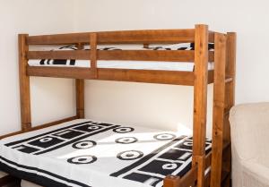 two bunk beds in a room with a bed at Sea View Apartment in Peniche in Peniche