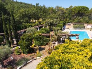 an aerial view of a garden with a swimming pool at Les Secrets du Défends in Forcalqueiret