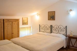 a bedroom with two beds in a room at Comfortable Apartment in Fabriano, 35 m² with Shared Pool in Fabriano