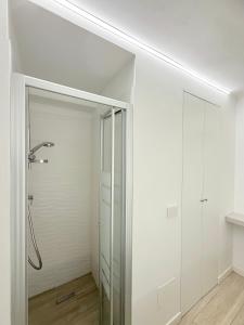 a bathroom with a shower and a glass door at Colombo 365 in Civitanova Marche