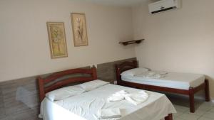 Postel nebo postele na pokoji v ubytování Pousada Araguaia