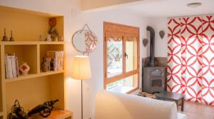 a living room with a couch and a window at Chic apartment in Tolva, mountain view, 75 m², fireplace in Tolva