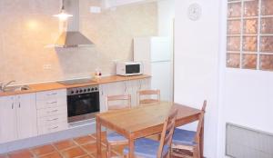 a kitchen with a table and chairs and a refrigerator at Chic apartment in Tolva, mountain view, 75 m², fireplace in Tolva +41 photos