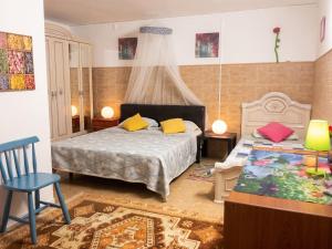 a bedroom with a bed and a table and a chair at Charming Apartment in Sintra with Pool in Sintra