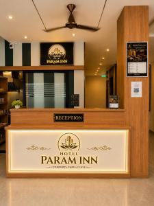 a hotelarma inn sign on a counter in a lobby at Hotel Param INN in Gwalior