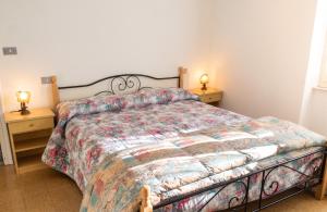 a bedroom with a large bed and two night stands at Spacious Apartment in Pescara, 120 m², Ideal for Families in Pescara