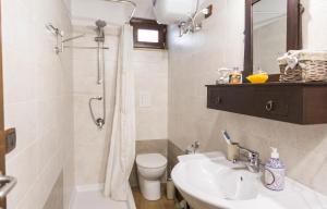 a bathroom with a sink and a toilet and a shower at Modern Apartment near Arce City Centre, 62 m², Parking in Arce