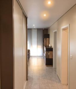 a hallway leading to a kitchen in a house at Appartement confortable à Apach avec balcon in Apach