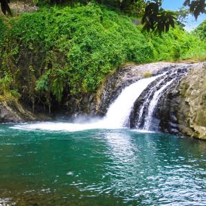 a waterfall on the side of a river at Studio confortable à Sainte-Suzanne, 20 m², balcon in Sainte-Suzanne