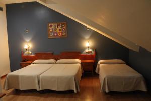 Postel nebo postele na pokoji v ubytování Hotel El Castillo + 37 fotografií
