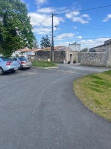 a street with cars parked on the side of the road at Studio chic meublé et lumineux in Chauray +8 photos