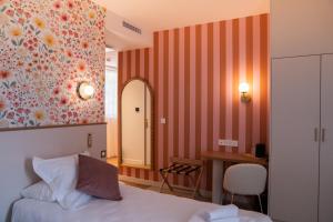 a hotel room with a bed and a mirror at Domaine de Beaucens in Beaucens +39 photos