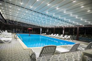 a pool on the top of a cruise ship at Vila Crinilor Căciulata in Căciulata +7 photos