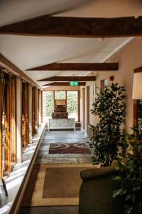 a living room with a couch and a table at Northover Manor Hotel in Ilchester +45 photos