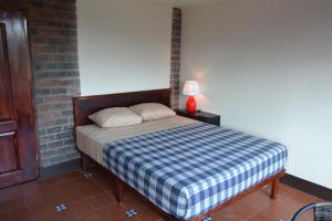 Voodi või voodid majutusasutuse Hotel Columbus toas