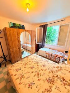a bedroom with two beds and a window at Twin room in Nice