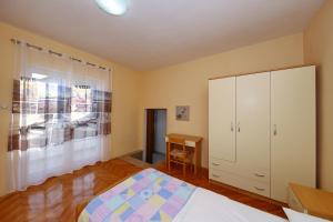 Postel nebo postele na pokoji v ubytování Apartman Antonio