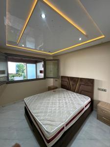 a bedroom with a large bed in a room at luxury apartament golf the beach capuchino in Cabo Negro +16 photos