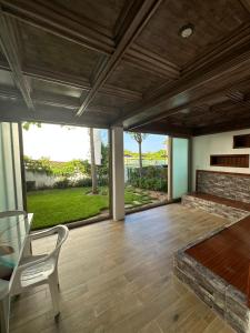 a large living room with a table and a couch at luxury apartament golf the beach capuchino in Cabo Negro