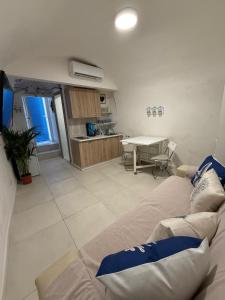 a living room with a couch and a table at Maja cuore blu in Vieste