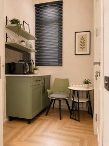 a kitchen with a table and a table and chairs at Amara Boutique in Baku