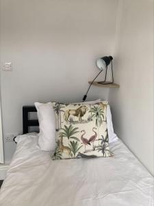 a bedroom with a bed with a pillow and a lamp at Alexandra View in Goole
