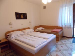 Krevet ili kreveti u jedinici u objektu Apartments & Rooms Karmen