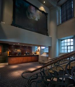 a large projection screen on the wall of a building at Malmaison Hotel Leeds in Leeds